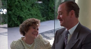 Movie still from “Dirty Rotten Scoundrels” (1988), directed by Frank Oz – A man and a woman sitting next to each other; Close Up shot, Over the shoulder angle