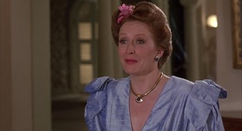 Movie still from “Dirty Rotten Scoundrels” (1988), directed by Frank Oz – A person wearing a dress; Close Up shot, Over the shoulder angle