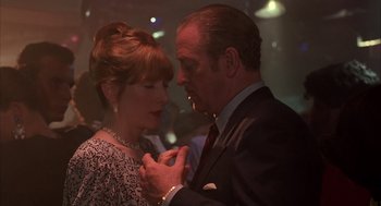 Movie still from “Dirty Rotten Scoundrels” (1988), directed by Frank Oz – An older man and a younger woman dancing together; Close Up shot, Low angle