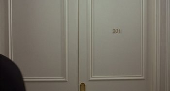 The door of a room with the number 3 0 1 on it