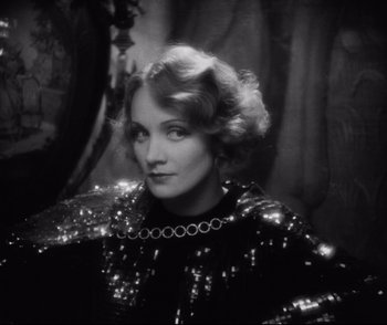 Movie still from “Dishonored” (1931), directed by Josef von Sternberg – An old photo of an older woman in a black dress; Close Up shot, High angle