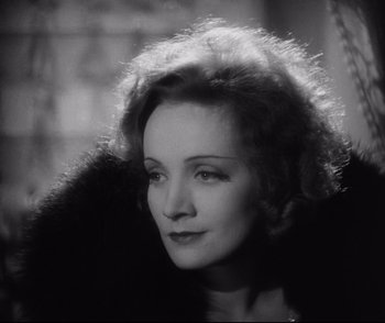 Movie still from “Dishonored” (1931), directed by Josef von Sternberg – An old photo of a woman with a fur coat looking to her left; Close Up shot, High angle