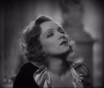 Movie still from “Dishonored” (1931), directed by Josef von Sternberg – An old photo of a woman in a black and white photo; Close Up shot, Low angle