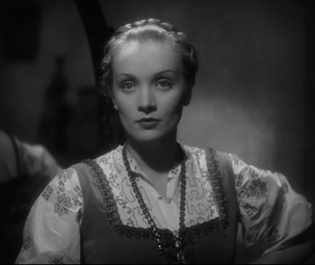 Movie still from “Dishonored” (1931), directed by Josef von Sternberg – A black - and - white photo of a woman in a dress; Close Up shot, Low angle