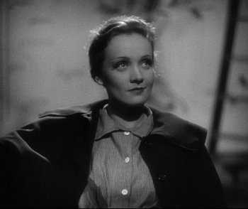 Movie still from “Dishonored” (1931), directed by Josef von Sternberg – A black - and - white photo of a woman looking up; Close Up shot, High angle