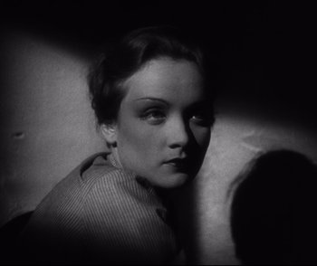 Movie still from “Dishonored” (1931), directed by Josef von Sternberg – A black - and - white photo of a woman's face; Close Up shot, High angle