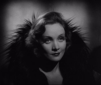 Movie still from “Dishonored” (1931), directed by Josef von Sternberg – An old photo of a woman in a fur coat; Close Up shot, Low angle