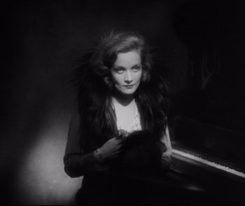 Movie still from “Dishonored” (1931), directed by Josef von Sternberg – A black - and - white photo of a woman in a fur coat; Close Up shot, Low angle