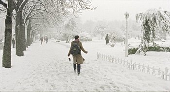 Movie still from “Distant” (2002), directed by Nuri Bilge Ceylan – A person walking in the snow with a backpack; Extreme Wide shot, Low angle