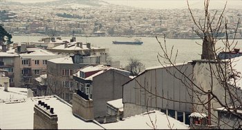 Movie still from “Distant” (2002), directed by Nuri Bilge Ceylan – A view of a large body of water from a hill; Extreme Wide shot, Low angle