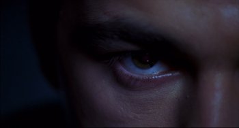 Movie still from “Disturbing Behavior” (1998), directed by David Nutter – A person's blue eye; Extreme Close Up shot, Overhead angle