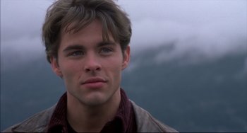 Movie still from “Disturbing Behavior” (1998), directed by David Nutter – A man that is looking into the camera; Close Up shot, Over the shoulder angle