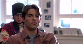 Movie still from “Disturbing Behavior” (1998), directed by David Nutter – A young man is looking into the distance; Close Up shot, Over the shoulder angle