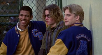 Movie still from “Disturbing Behavior” (1998), directed by David Nutter – A group of young men standing next to each other; Medium shot, Low angle