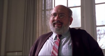 Movie still from “Disturbing Behavior” (1998), directed by David Nutter – An older man with a beard wearing glasses and a tie; Close Up shot, Low angle