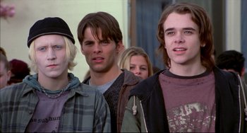 Movie still from “Disturbing Behavior” (1998), directed by David Nutter – A group of young men standing next to each other; Medium shot, Low angle