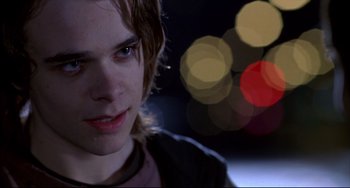 Movie still from “Disturbing Behavior” (1998), directed by David Nutter – A person with a blurry background; Close Up shot, Over the shoulder angle