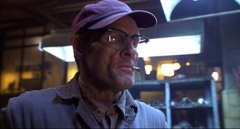 Movie still from “Disturbing Behavior” (1998), directed by David Nutter – A person wearing glasses and a hat; Close Up shot, Low angle