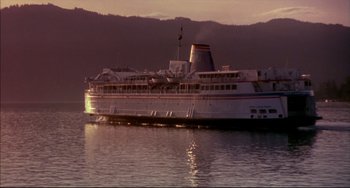 Movie still from “Disturbing Behavior” (1998), directed by David Nutter – A large white boat floating on top of a body of water; Extreme Wide shot, High angle