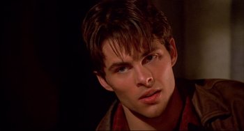 Movie still from “Disturbing Behavior” (1998), directed by David Nutter – A person wearing a red shirt; Close Up shot, Over the shoulder angle