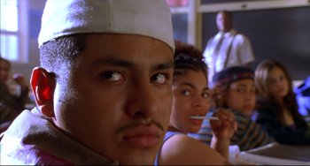 Movie still from “Disturbing Behavior” (1998), directed by David Nutter – A group of people sitting next to each other in a room; Close Up shot, Low angle