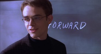 Movie still from “Disturbing Behavior” (1998), directed by David Nutter – A young man wearing glasses and a black sweater; Close Up shot, Low angle