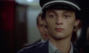 Movie still from “Diva” (1981), directed by Jean-Jacques Beineix – A person wearing a hat; Close Up shot, High angle