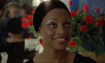 Movie still from “Diva” (1981), directed by Jean-Jacques Beineix – A person wearing a hat; Close Up shot, Over the shoulder angle