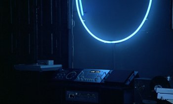 Movie still from “Diva” (1981), directed by Jean-Jacques Beineix – A room that has some kind of equipment in it; Medium shot, High angle