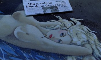 Movie still from “Diva” (1981), directed by Jean-Jacques Beineix – A woman laying on the ground with a cigarette in her mouth; Extreme Close Up shot, Overhead angle