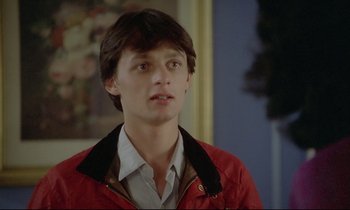 Movie still from “Diva” (1981), directed by Jean-Jacques Beineix – A young man in a red jacket looking at the camera; Close Up shot, Low angle