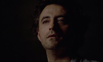 Movie still from “Diva” (1981), directed by Jean-Jacques Beineix – A person looking at the camera; Close Up shot, Low angle