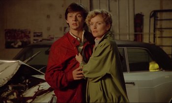 Movie still from “Diva” (1981), directed by Jean-Jacques Beineix – A man and a woman standing next to each other; Medium shot, Low angle