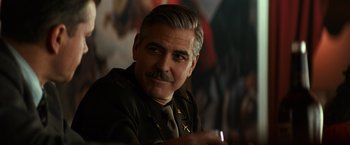 Movie still from “The Monuments Men” (2014), directed by George Clooney – A man with a mustache wearing a military uniform; Close Up shot, Over the shoulder angle