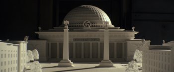 Movie still from “The Monuments Men” (2014), directed by George Clooney – A building that has a dome on top of it; Extreme Wide shot, High angle