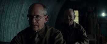 Movie still from “The Monuments Men” (2014), directed by George Clooney – A man with glasses and a beard and a man with glasses and a beard; Close Up shot, Over the shoulder angle