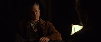 Movie still from “The Monuments Men” (2014), directed by George Clooney – A person sitting in a chair; Medium shot, Low angle