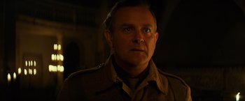 Movie still from “The Monuments Men” (2014), directed by George Clooney – A person wearing a military uniform; Close Up shot, Low angle