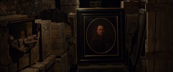 Movie still from “The Monuments Men” (2014), directed by George Clooney – A painting of a man in a black frame; Close Up shot, High angle