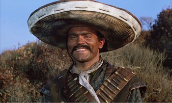 Movie still from “Django” (1966), directed by Sergio Corbucci – A man with a mustache wearing a mexican hat; Close Up shot, Low angle