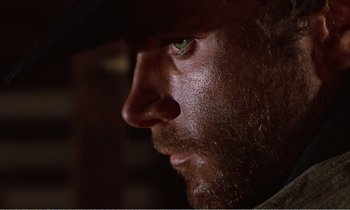 Movie still from “Django” (1966), directed by Sergio Corbucci – A man's face in a dark room; Close Up shot, Low angle