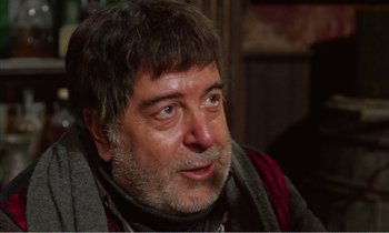 Movie still from “Django” (1966), directed by Sergio Corbucci – An older man with a beard and mustache; Close Up shot, Over the shoulder angle