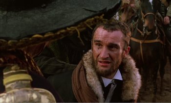 Movie still from “Django” (1966), directed by Sergio Corbucci – A man with a beard and a fur collared jacket; Close Up shot, Over the shoulder angle