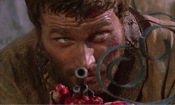 Movie still from “Django” (1966), directed by Sergio Corbucci – A man's face with blood on his face; Close Up shot, Low angle