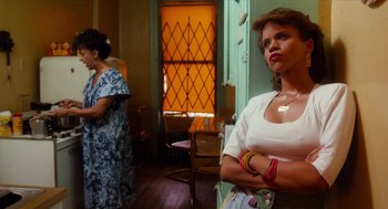 Movie still from “Do the Right Thing” (1989), directed by Spike Lee – Two women standing in front of each other in a room; Medium shot, Low angle