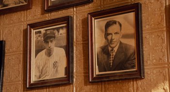 Movie still from “Do the Right Thing” (1989), directed by Spike Lee – A couple of pictures hanging on the wall of a baseball player; Close Up shot, Low angle