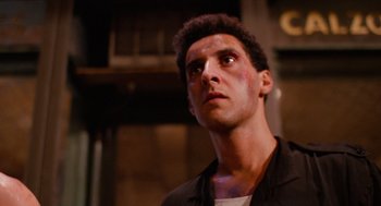 Movie still from “Do the Right Thing” (1989), directed by Spike Lee – A person looking up at something; Close Up shot, Low angle