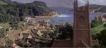 Movie still from “Doctor Dolittle” (1967), directed by Richard Fleischer – An aerial view of a small town with boats in the water; Extreme Wide shot, High angle