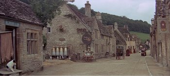 Movie still from “Doctor Dolittle” (1967), directed by Richard Fleischer – An image of an old stone building with a horse drawn carriage in front of it; Extreme Wide shot, High angle