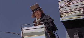 Movie still from “Doctor Dolittle” (1967), directed by Richard Fleischer – A man in a top hat and a long coat; Medium shot, Low angle